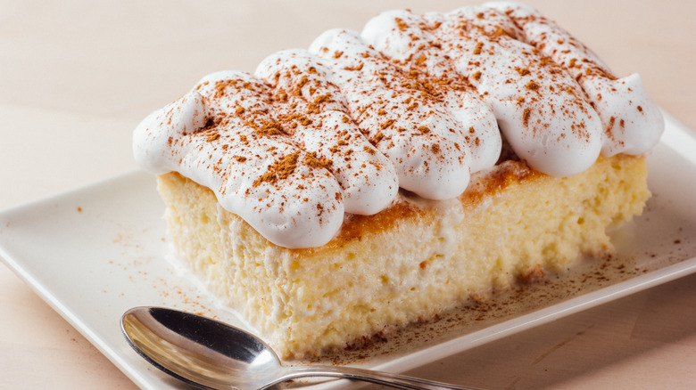 Moist tres leches cake on a plate
