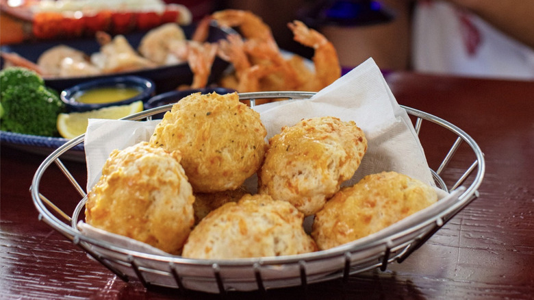 Red Lobster cheddar biscuits in front of seafood meal