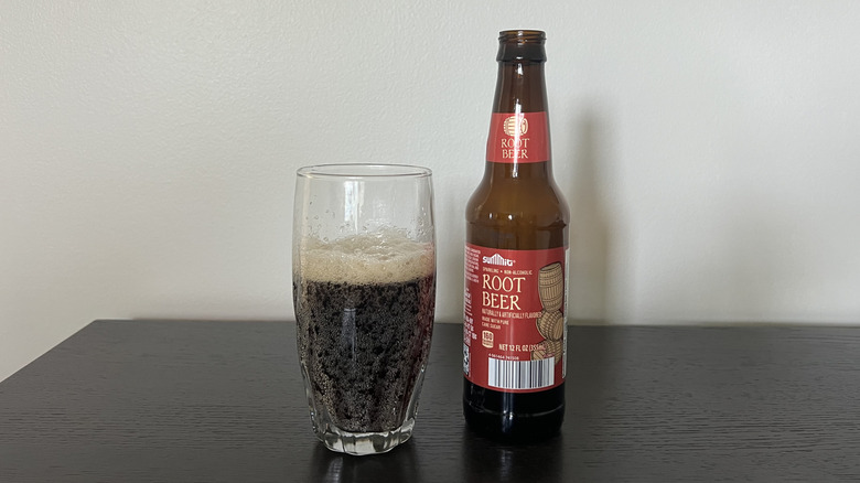 Aldi Summit root beer in a bottle and glass.