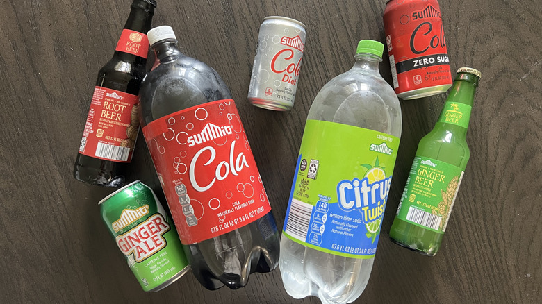 Aldi Summit brand sodas laid out on table.