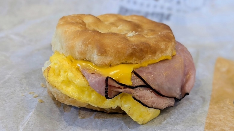 Ham, egg, and cheese biscuit on a fast food wrapper