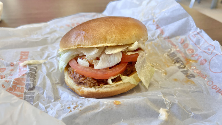 Side view of Spicy Royal Crispy Chicken on a wrapper