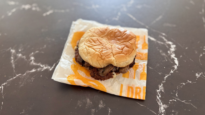 Culver's mushroom and Swiss burger on countertop