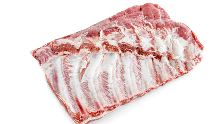 raw spareribs on white background