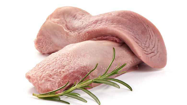 two pork tongues with rosemary