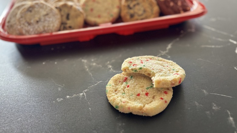 Costco sprinkle toffee sandy cookies with cookie tray in background