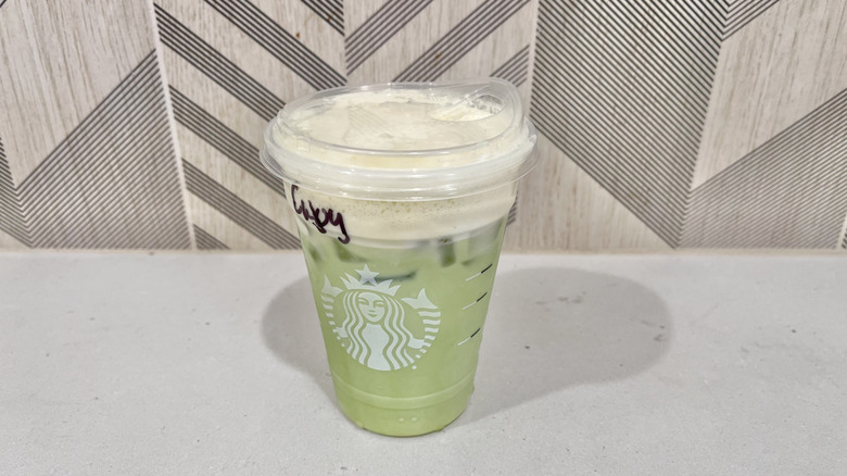 Plastic cup with Iced Mango Cream Matcha