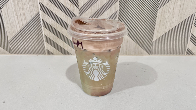 Cup of Iced Dubai Chocolate Matcha on a table