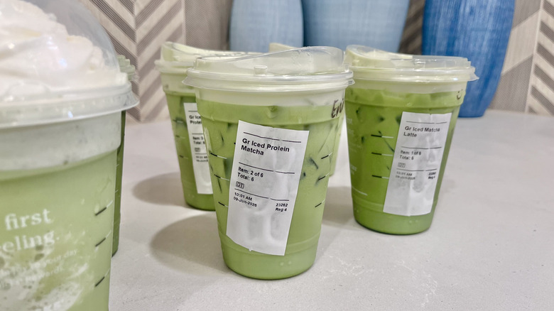Various Starbucks, Matcha beverages on a table