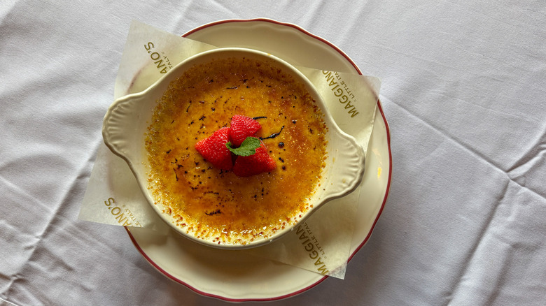 Creme brûlée topped with strawberries