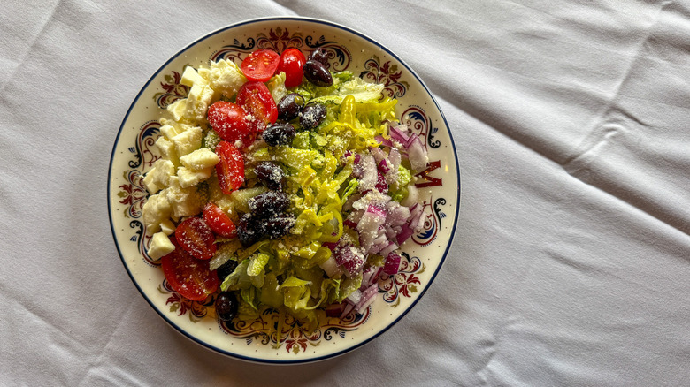Italian chopped salad on a patterned plate