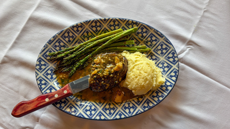 Plate of filet mignon, mashed potatoes, and asparagus