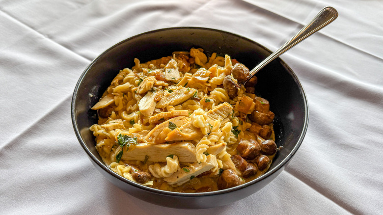 Bowl of gluten-free pasta with grilled chicken and mushrooms
