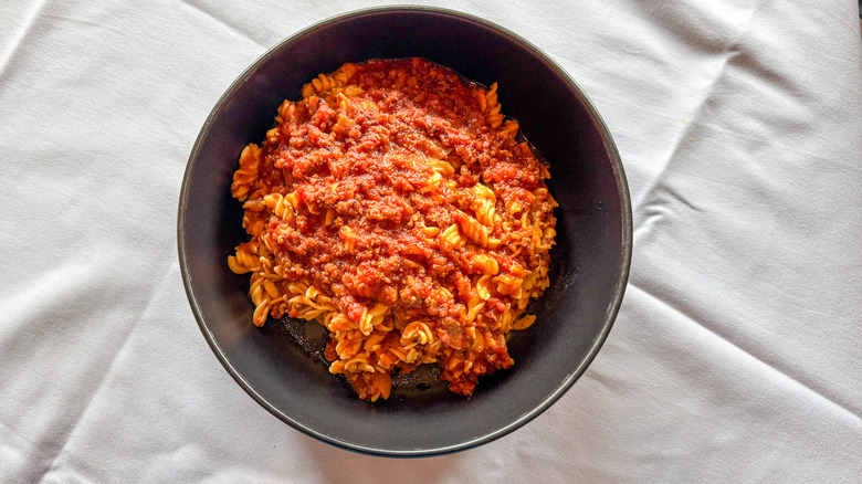 Bowl of gluten-free fusilli pasta with meat sauce