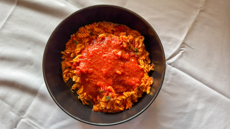 Bowl of fusilli pasta with marinara sauce