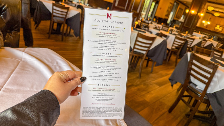 Hand holding Maggiano's gluten-free menu