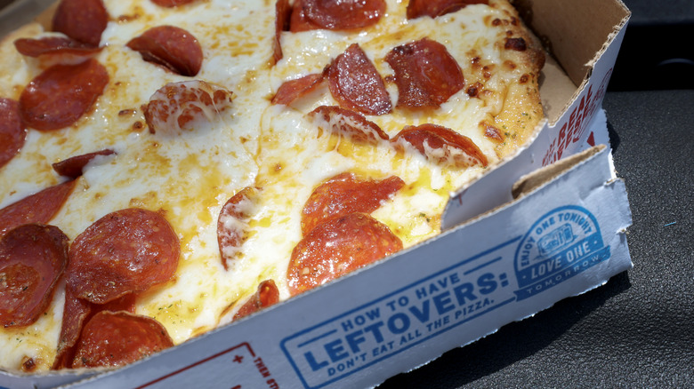 Domino's Pizza in a box loaded with toppigns