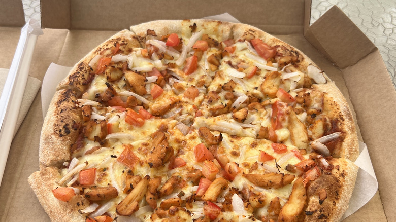 Pizza Hut pizza in a box with various toppings