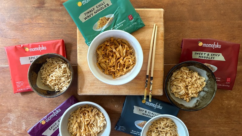 Five bowls set atop a variety of packaging