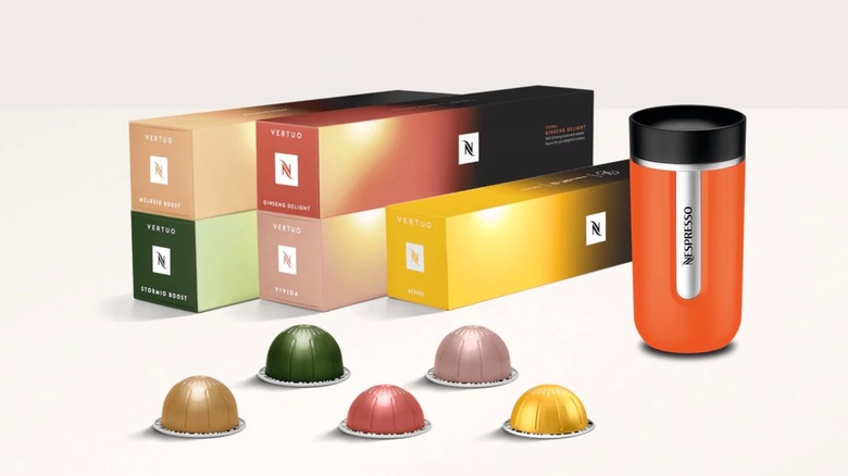 Nespresso Coffee+ Variety Pack boxes and pods next to orange travel mug