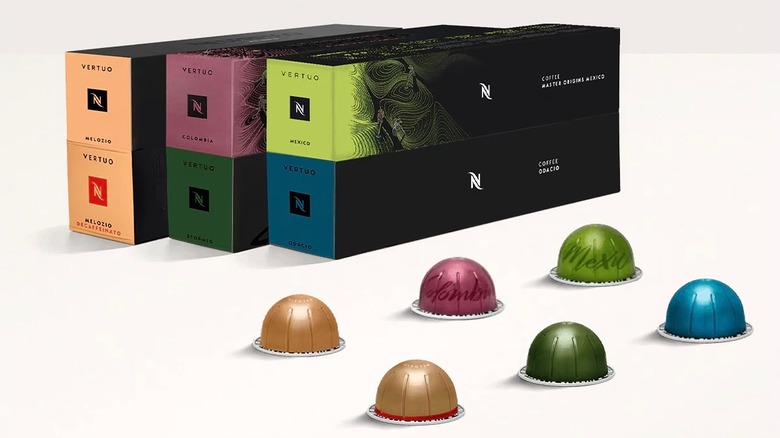 Nespresso Coffee Discovery Pack boxes and capsules on white surface