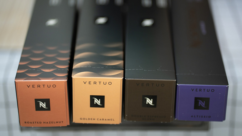 Four Nespresso Vertuo pod boxes in a line