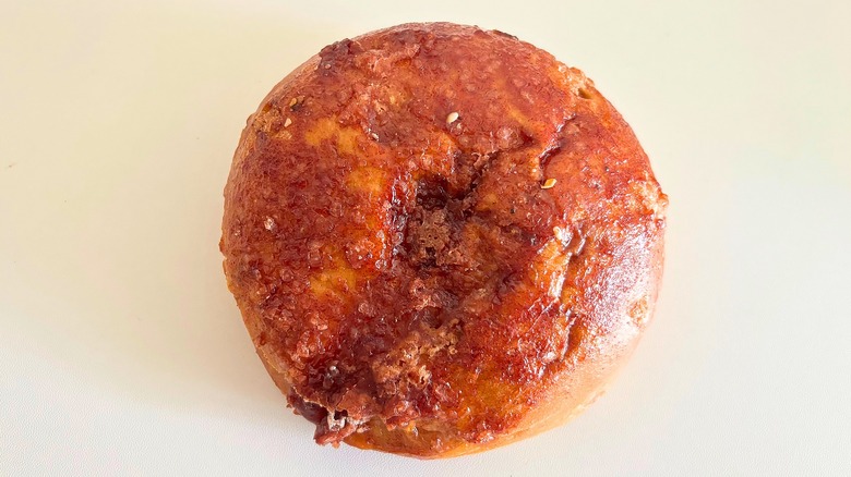 Top-down shot of Panera Cinnamon Crunch bagel on white surface