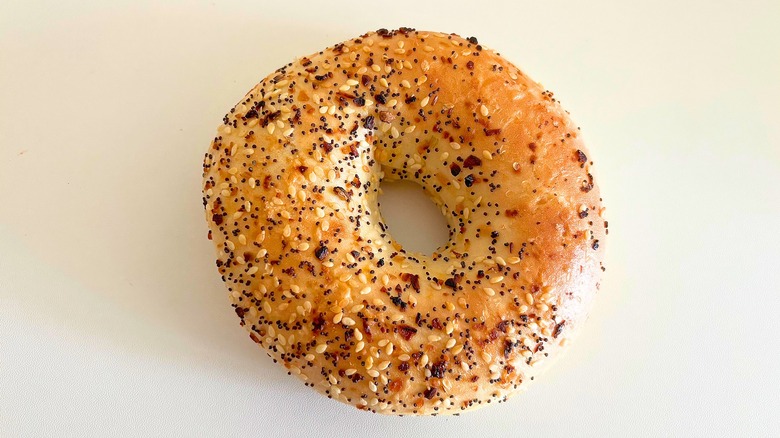 Top-down shot of Panera Everything bagel on white surface