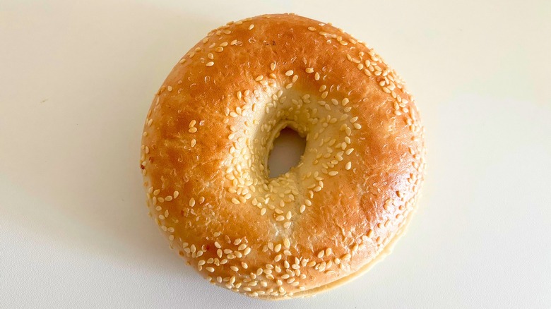 Top-down shot of Panera Sesame bagel on white surface