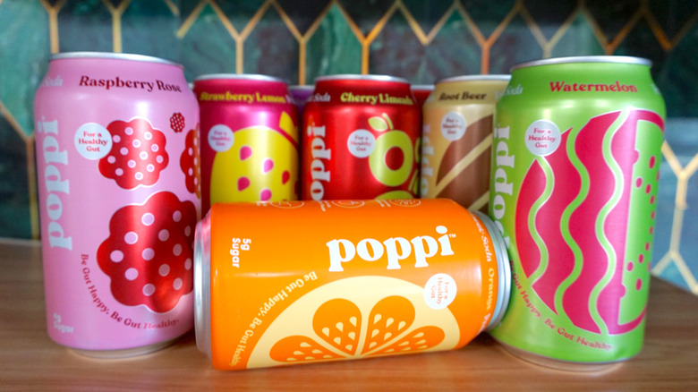 Variety of Poppi soda cans