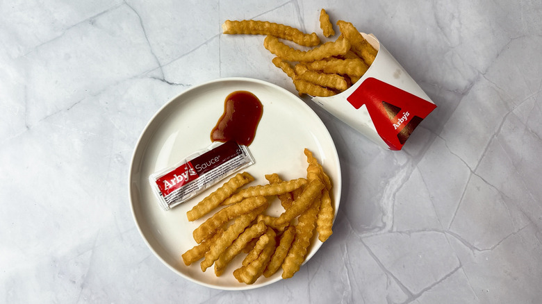 Arby's sauce and french fries on a plate