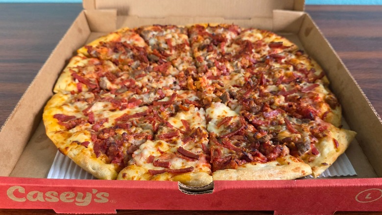 Casey's ultimate meat pizza in a pizza box