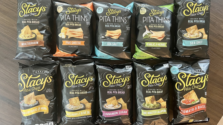 10 Stacy's pita chip bags laid out on table.