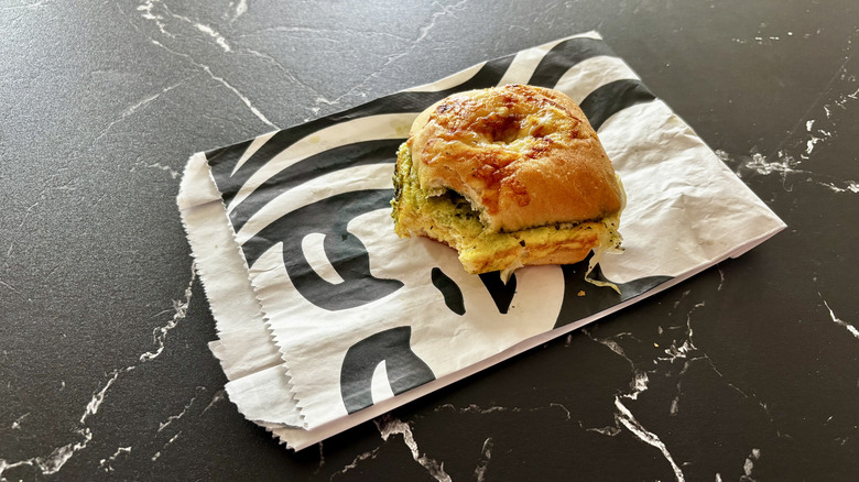 Starbucks egg, pesto, and mozzarella breakfast sandwich on wrapper