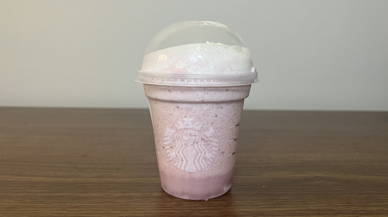 Starbucks Strawberry Creme Frappuccino in to-go cup.