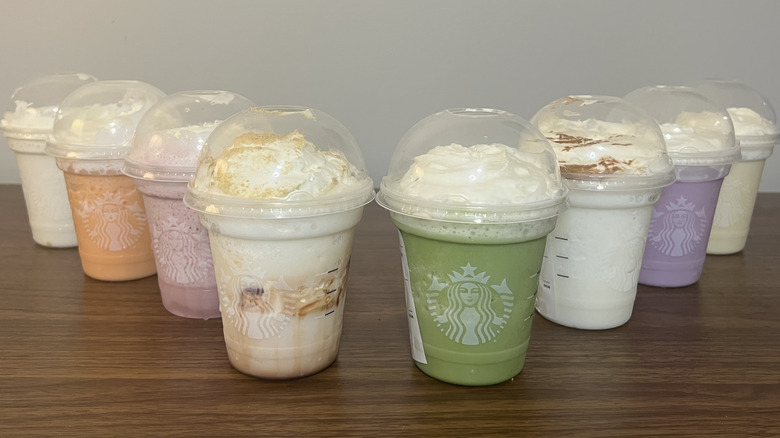 8 Starbucks Creme Frappuccinos lined up.