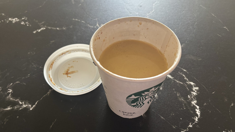 Starbucks cinnamon dolce latte with lid removed from cup