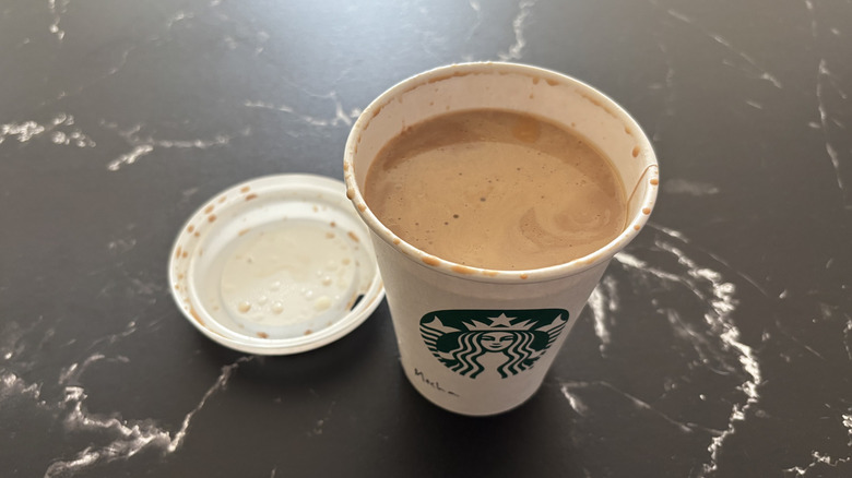 Starbucks mocha latte with lid removed from cup