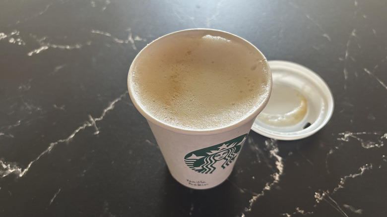 Starbucks' vanilla protein latte with lid removed from cup