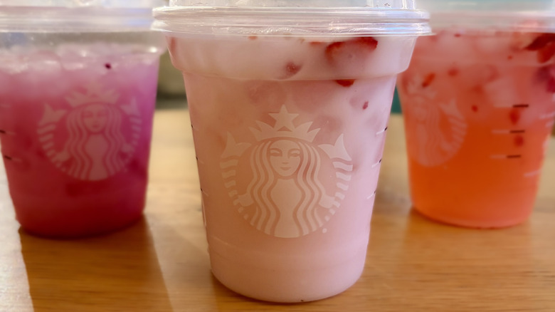 A Starbucks Pink Energy Drink with other drinks