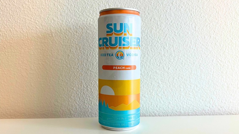 Can of Sun Cruiser Peach Iced Tea on white table
