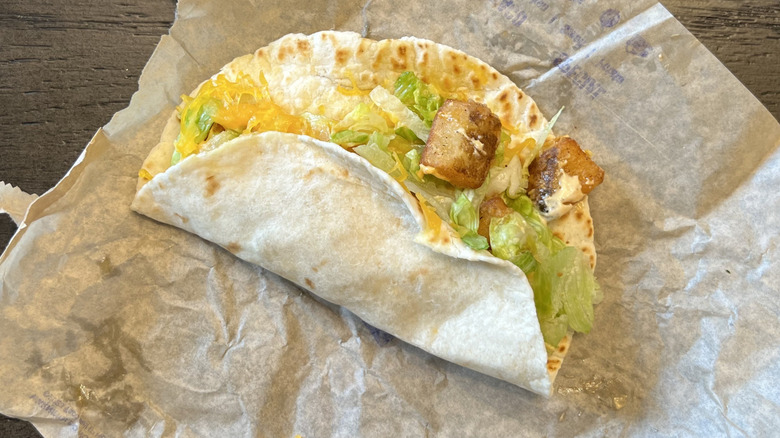 Taco Bell Spicy Potato Soft Taco on wrapper.