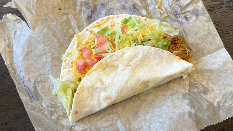 Taco Bell soft taco supreme on wrapper.