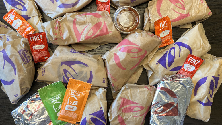 Every Taco Bell Taco in wrappers with hot sauces.