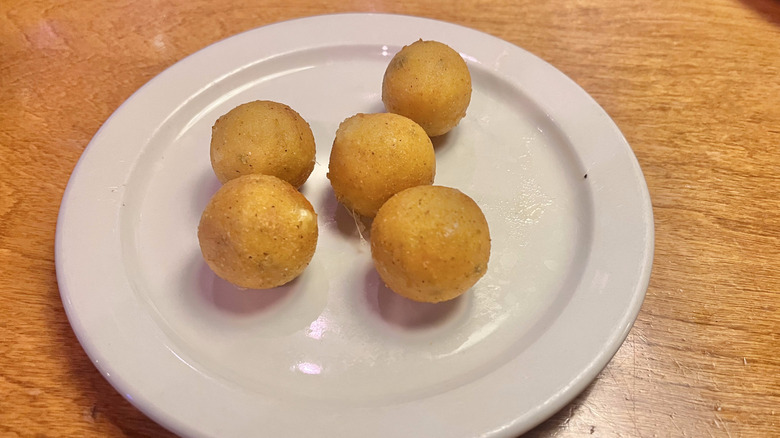 Five Rattlesnake Bite appetizer pieces on a plate