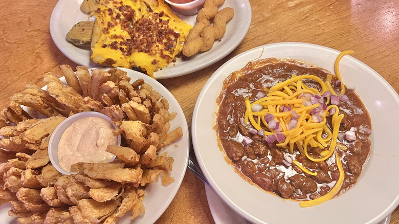 Three Texas roadhouse appetizers on the table