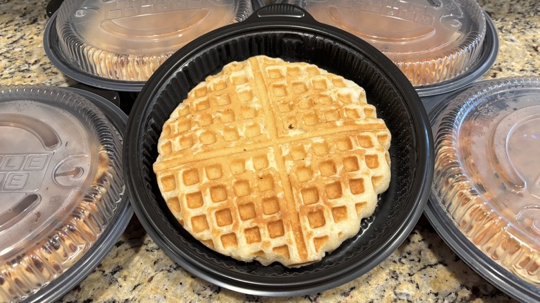 Waffle House classic waffle in branded to-go containers on marble counter