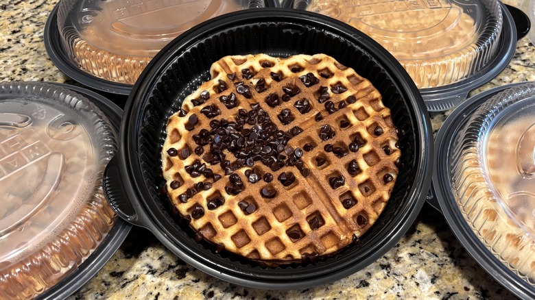 Waffle House chocolate chip waffle in branded to-go containers on marble counter