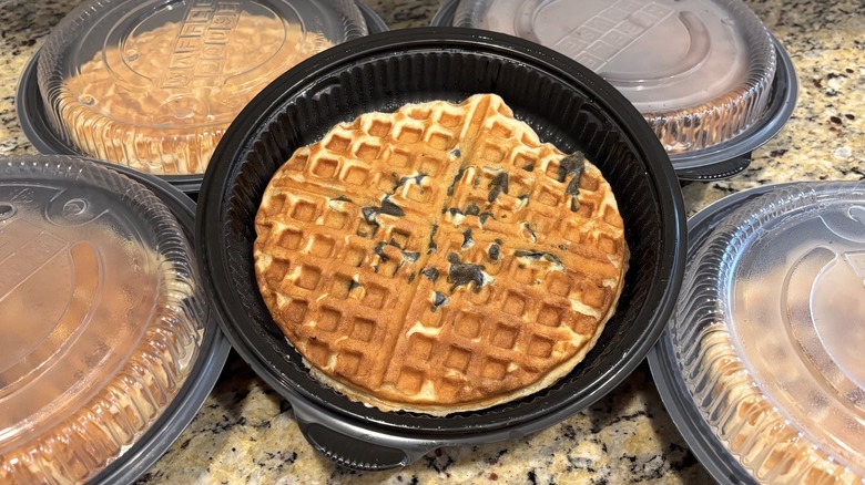 Waffle House blueberry waffle in branded to-go containers on marble counter