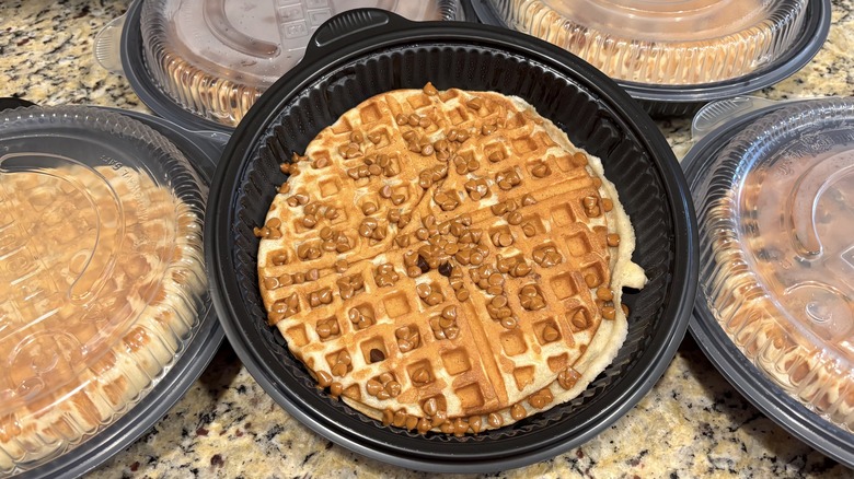 Waffle House peanut butter chip waffle in branded to-go containers on marble counter